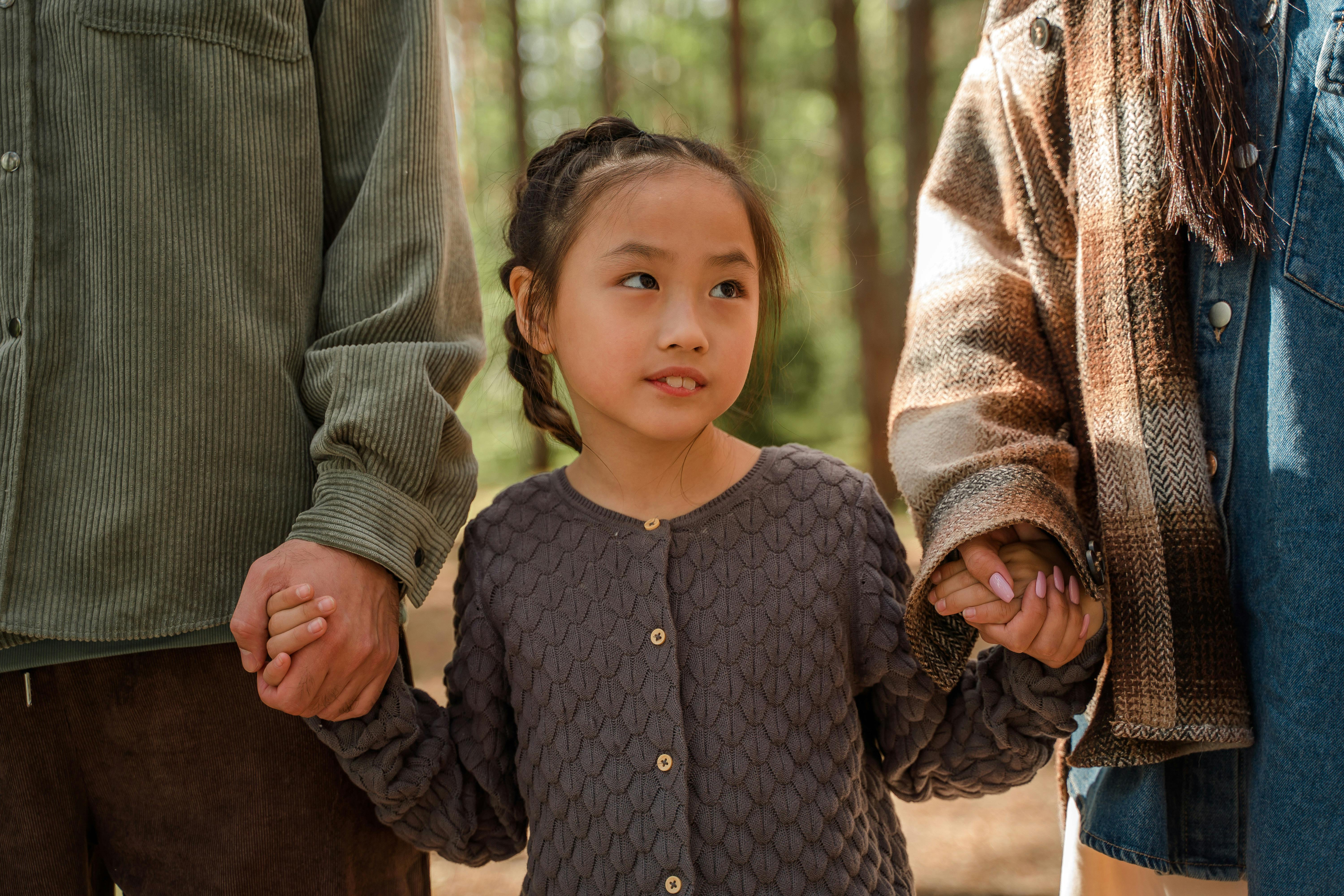 a young girl in gray sweater