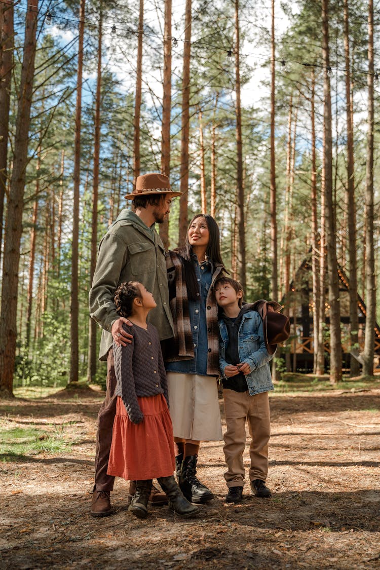 Family With Small Children On Vacation In The Forest