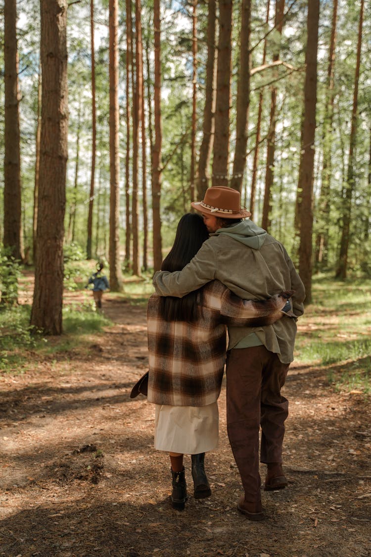 Couple Walking In The Woods