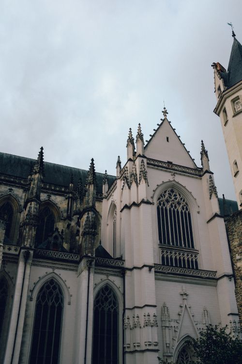 Free Low angle view of an ornate Gothic cathedral facade showcasing intricate designs and spires. Stock Photo
