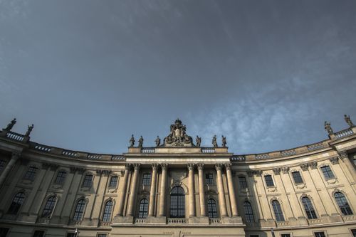 Free Stunning low-angle view of Humboldt University's historic facade against a cloudy sky in Berlin, Germany. Stock Photo