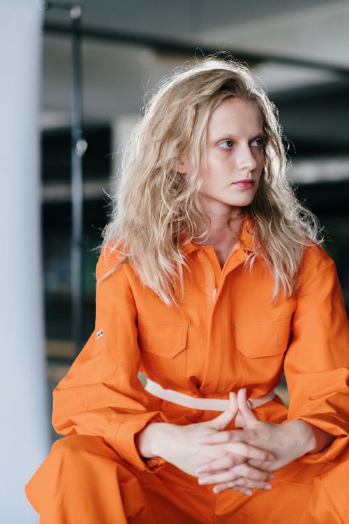 Woman in Orange Button Up Long Sleeve Shirt