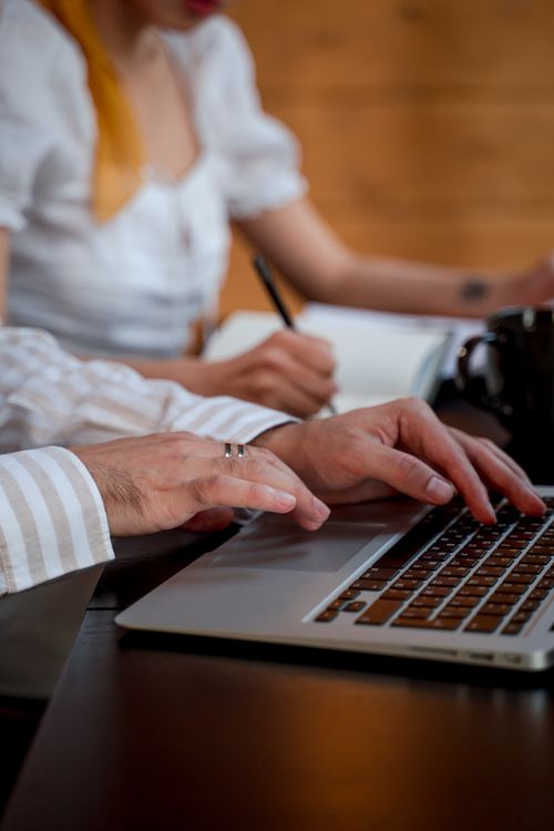 Writing In Computer Man Typing on a Laptop Computer · Free Stock Photo
