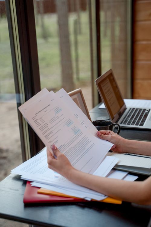A Person Holding Documents · Free Stock Photo
