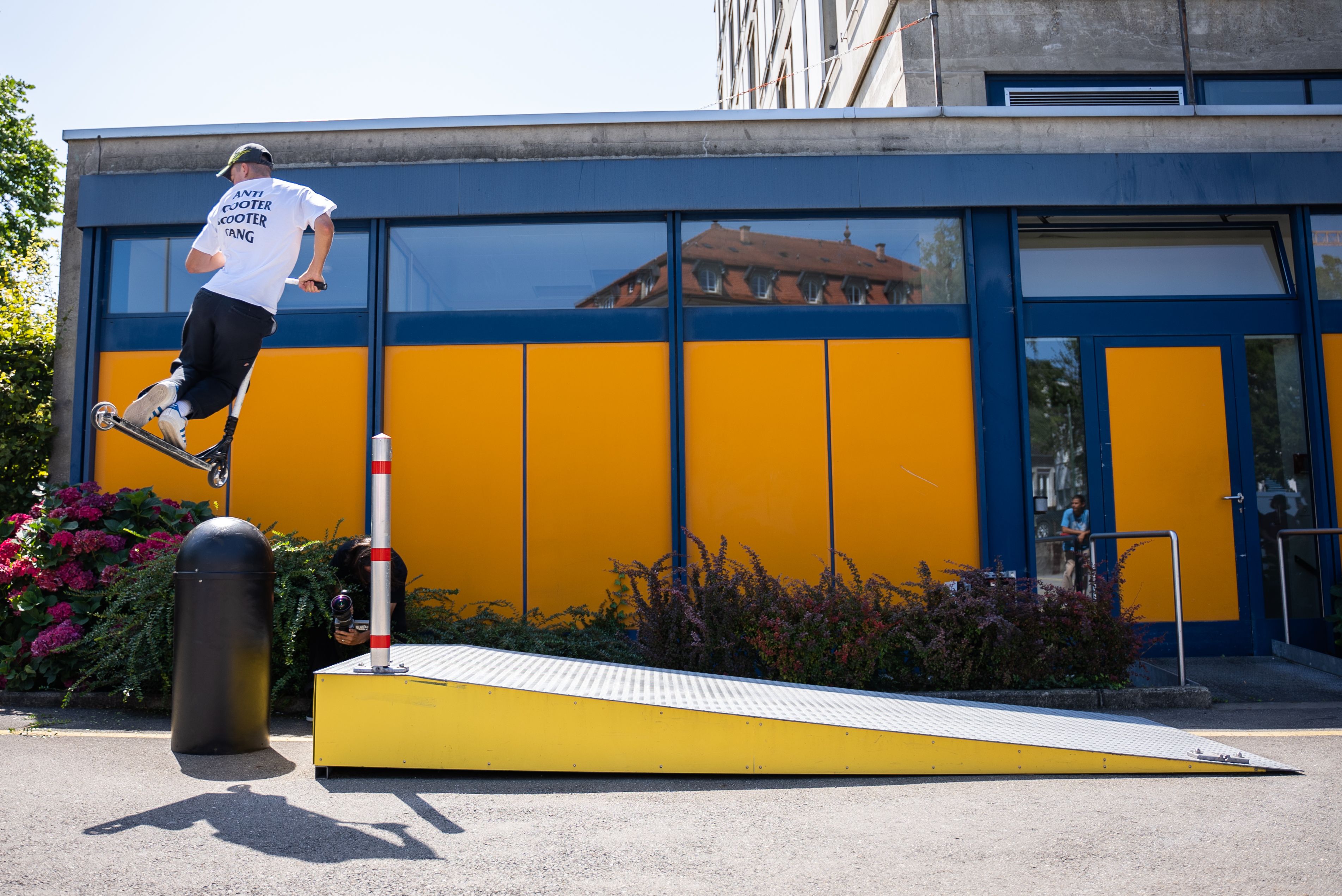 Young man on sidewalk jumping off railing on street · Free Stock Photo