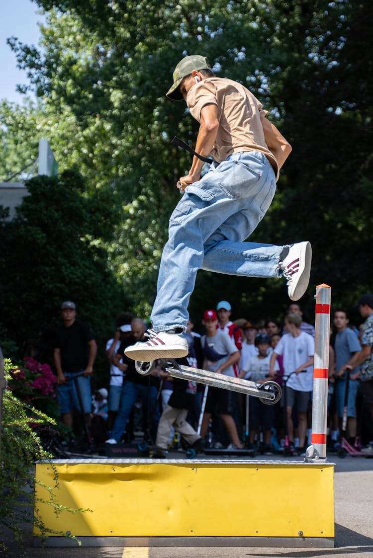 Man Doing Scooter Trick On Air