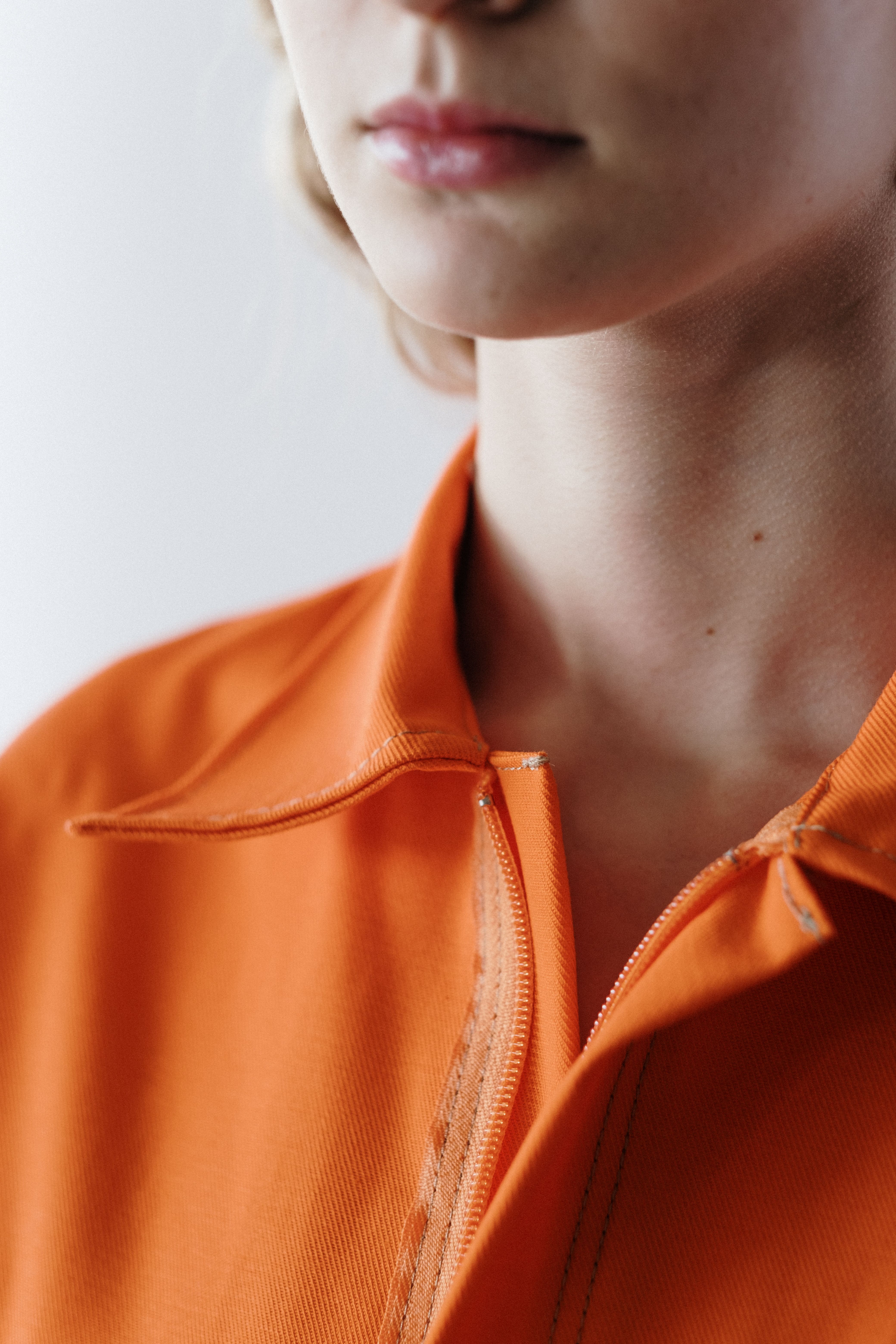 A Person in Orange Zip Up Shirt · Free Stock Photo