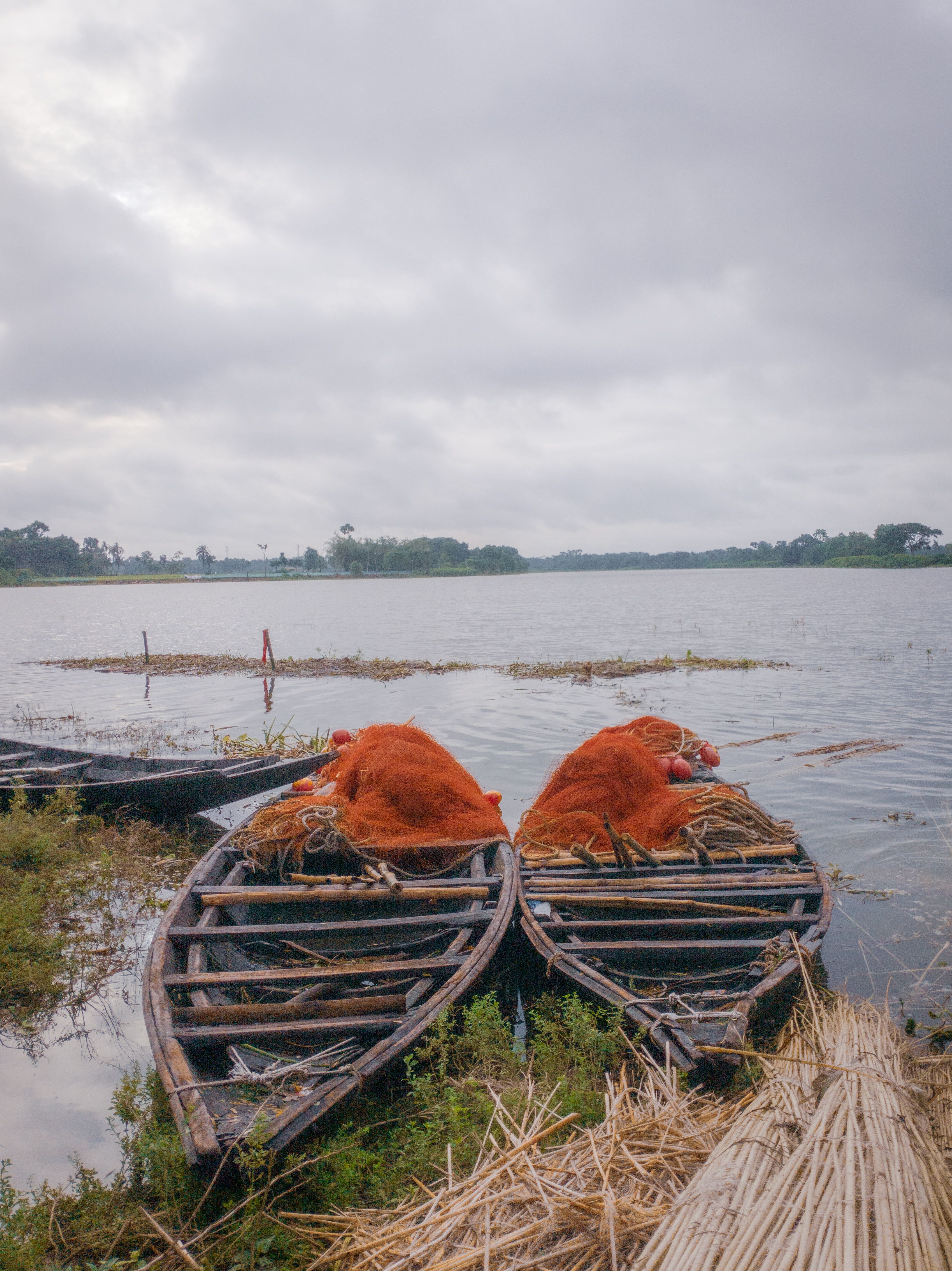 Brown Wooden Fishing Boats on Body of Water · Free Stock Photo
