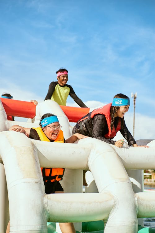 Women Having Fun on White Inflatable