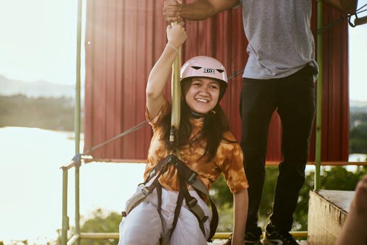 Girl Riding A Zip Line