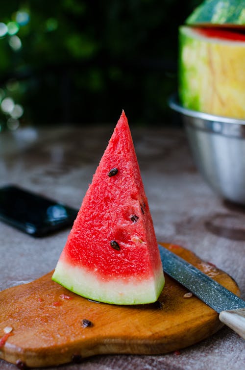 Free Sliced Watermelon on Brown Wooden Chopping Board Stock Photo