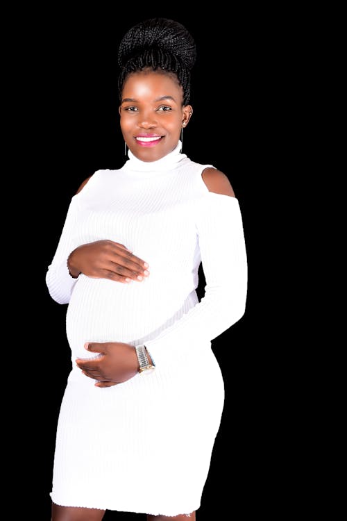 Pregnant Woman in White Dress
