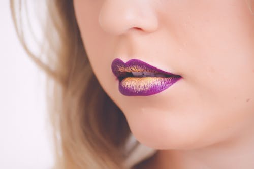 Woman Wearing Purple and Beige Lipstick