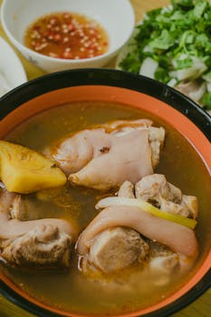 Delicious homemade pork soup with rich broth and fresh herbs. Perfect comforting meal.