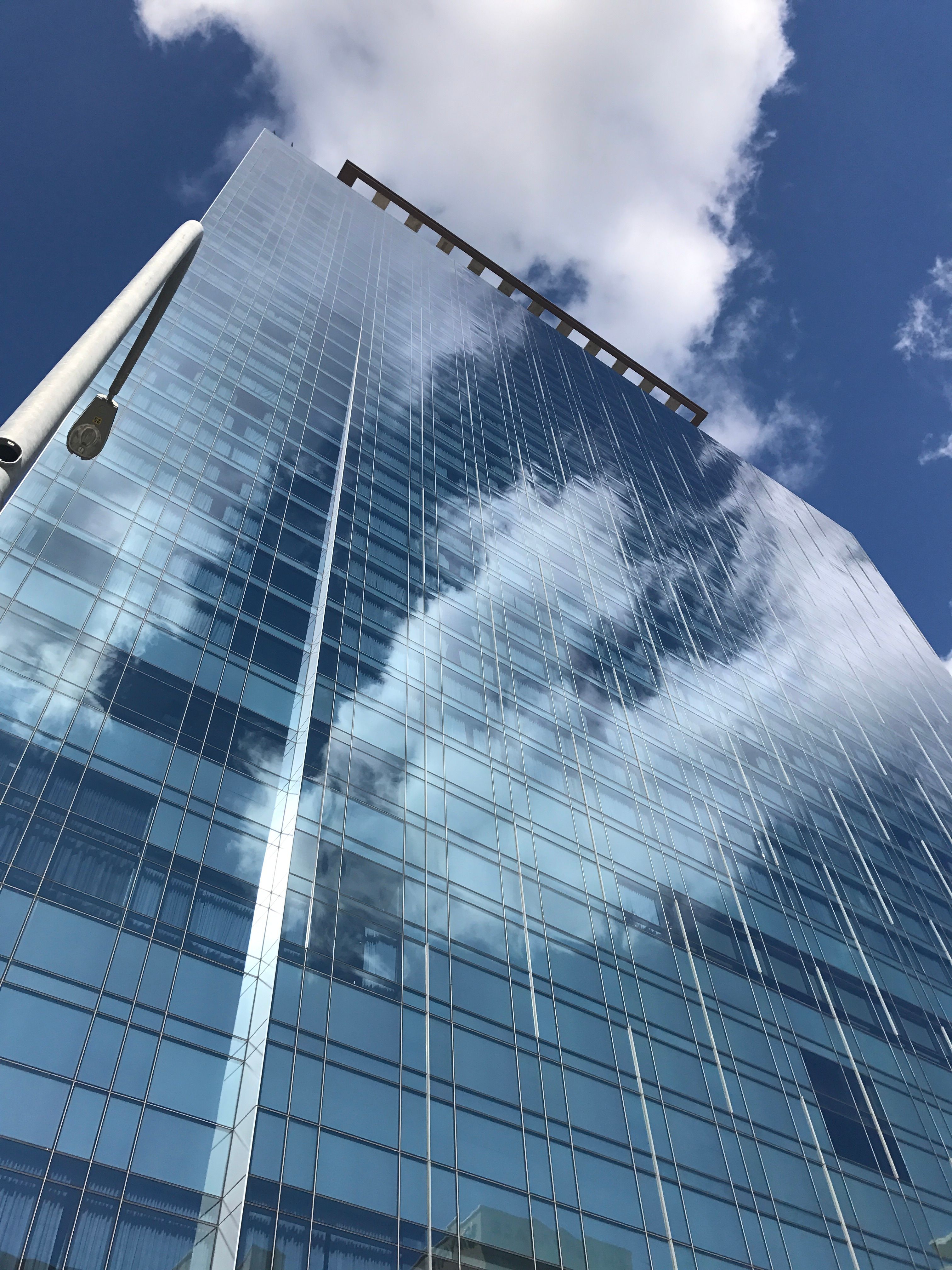 A Modern Glass House Under Blue Sky · Free Stock Photo