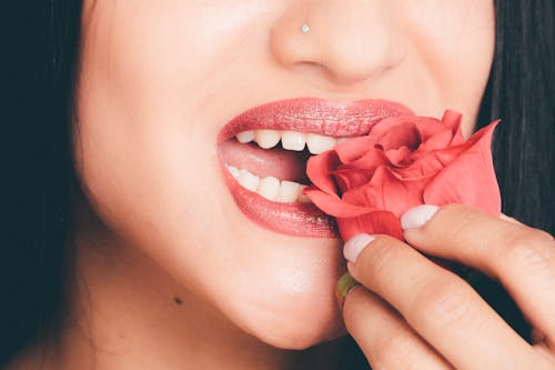 Woman Biting the Red Rose