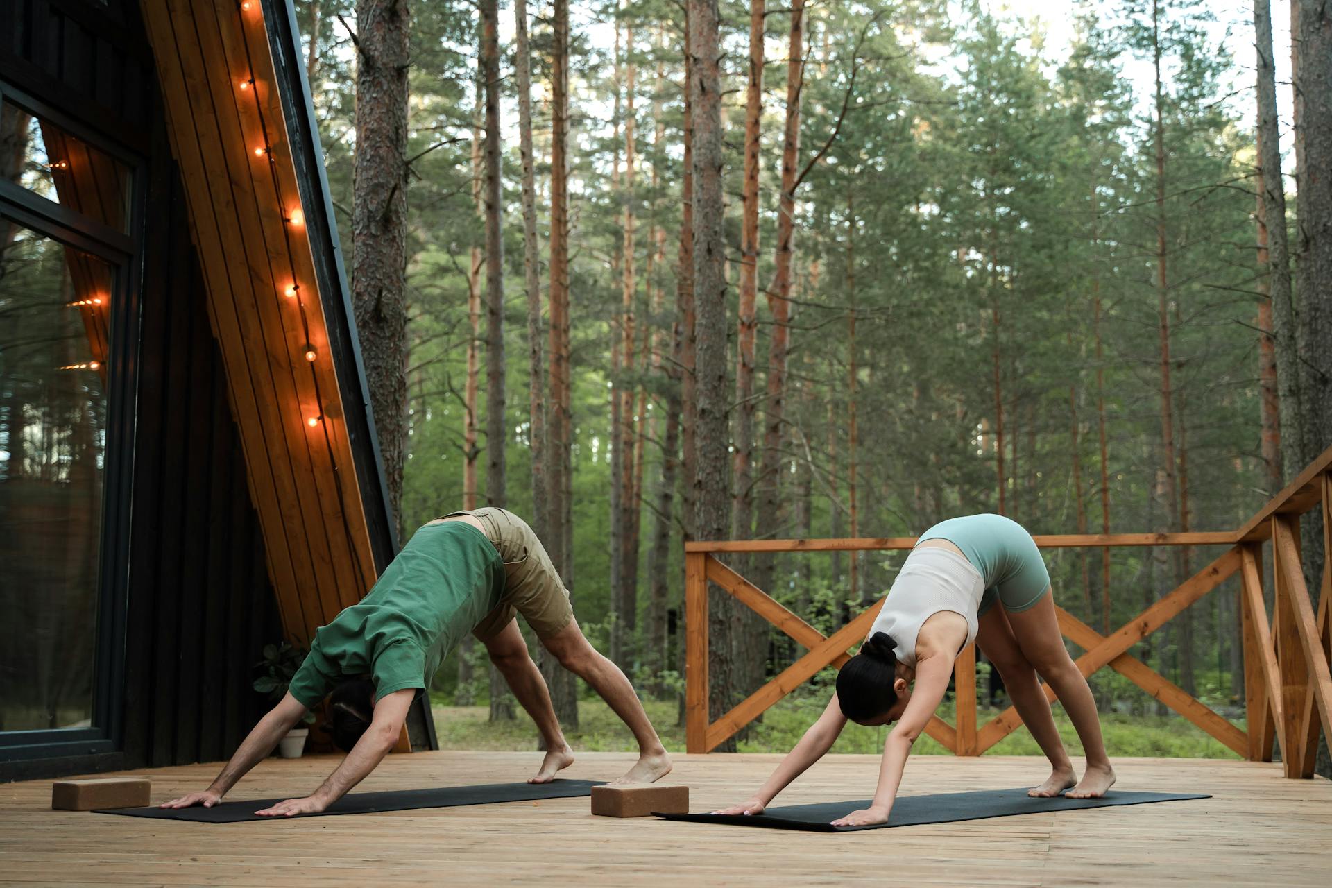 Couple doing Yoga on Cabin Patio