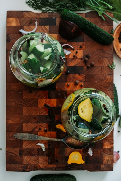 Top View of Glass Jars with Slices of Fruits and Vegetables 