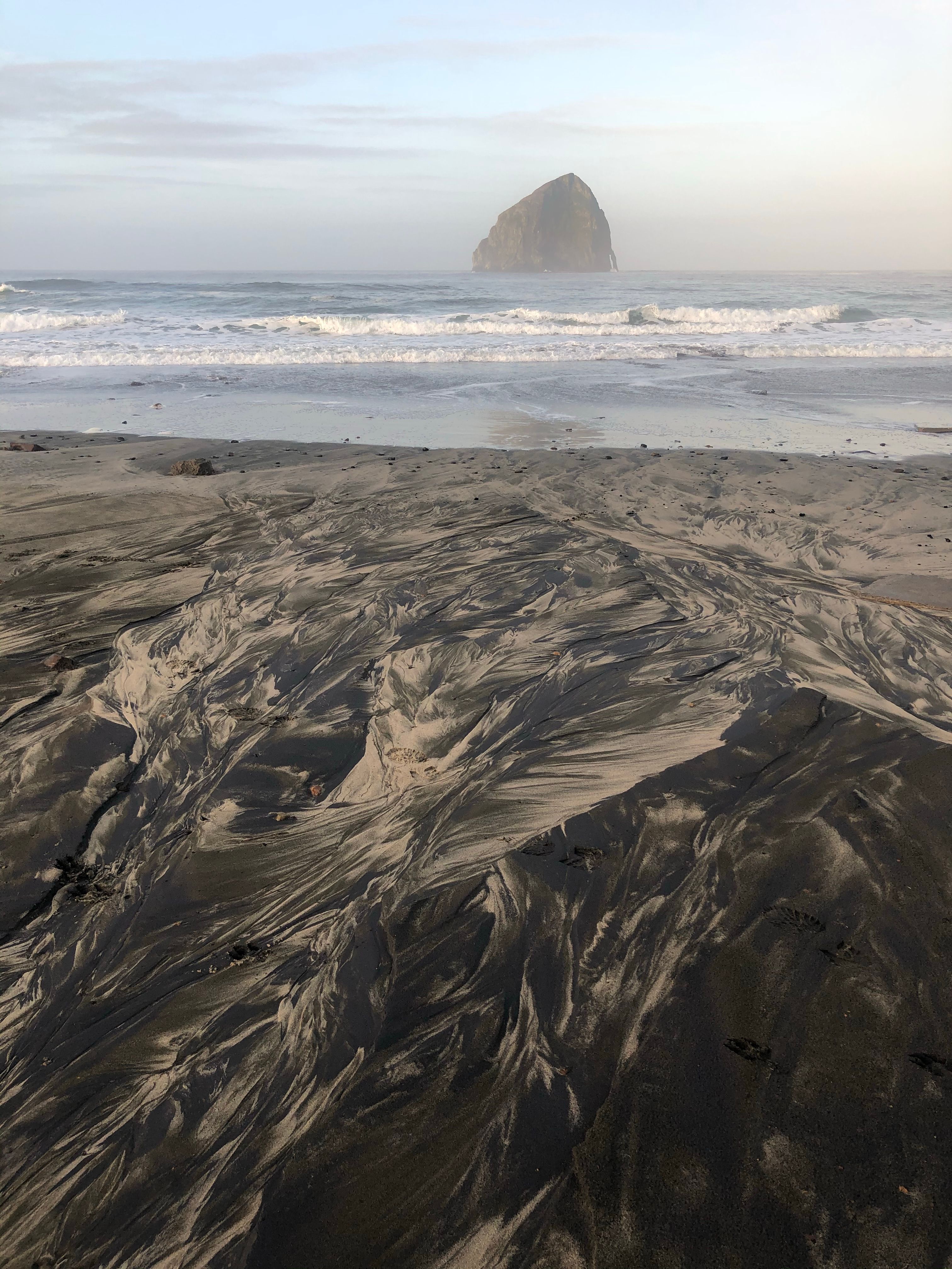 Oregon Coast beach with sea stack and dramatic shoreline