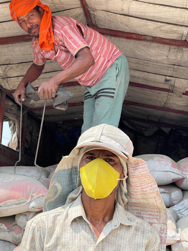 Workers Posing In Shawl And Mask