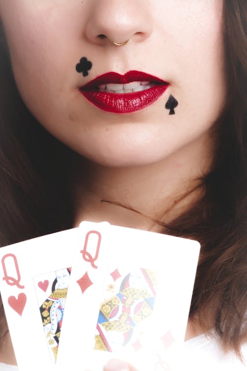 Woman Holding Queen of Hearts and Diamonds