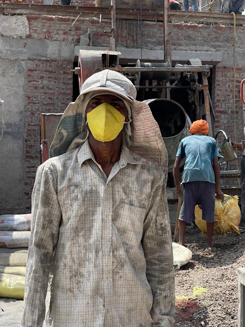 Laborer Wearing Yellow Face Mask 