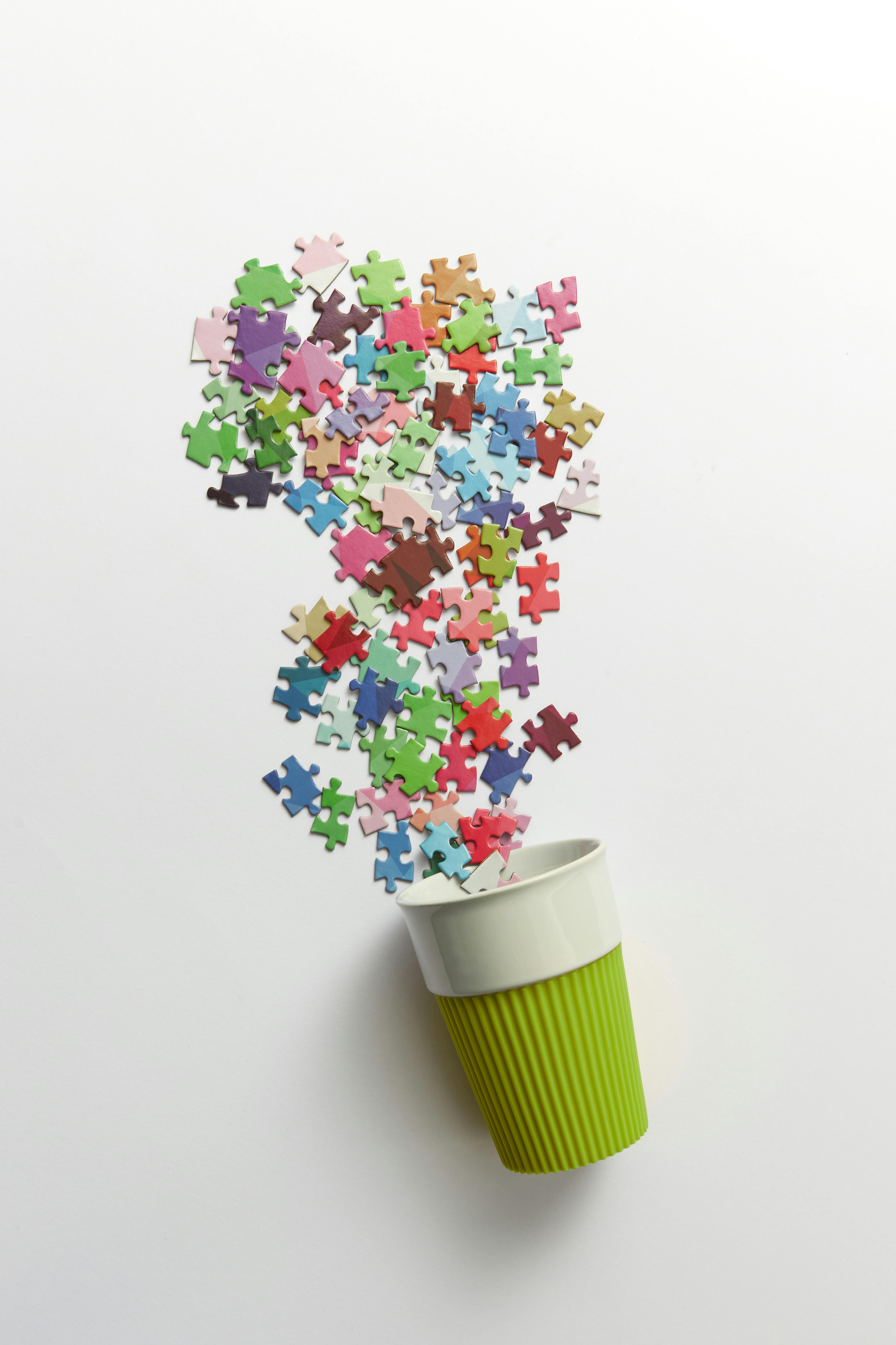 Disposable Paper Cup with Puzzle Pieces Forming Plant · Free Stock Photo