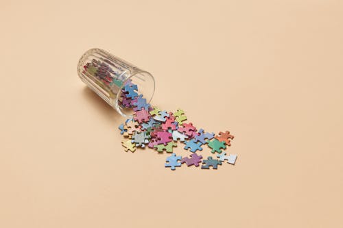 Free Clear Drinking Glass With Puzzle Pieces Stock Photo