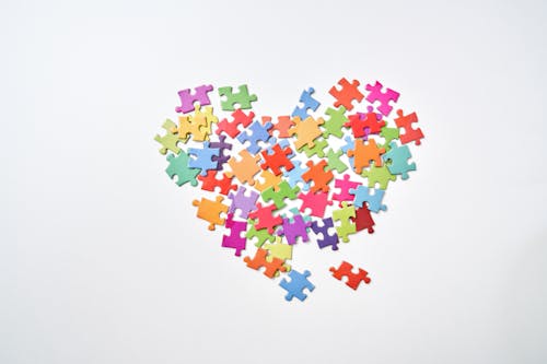 Colorful Jigsaw Pieces Arranged in a Shape of Heart