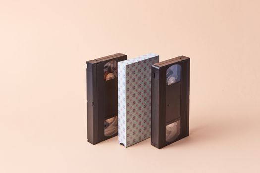 Three VHS tapes displayed on a neutral background, showcasing a vintage aesthetic.