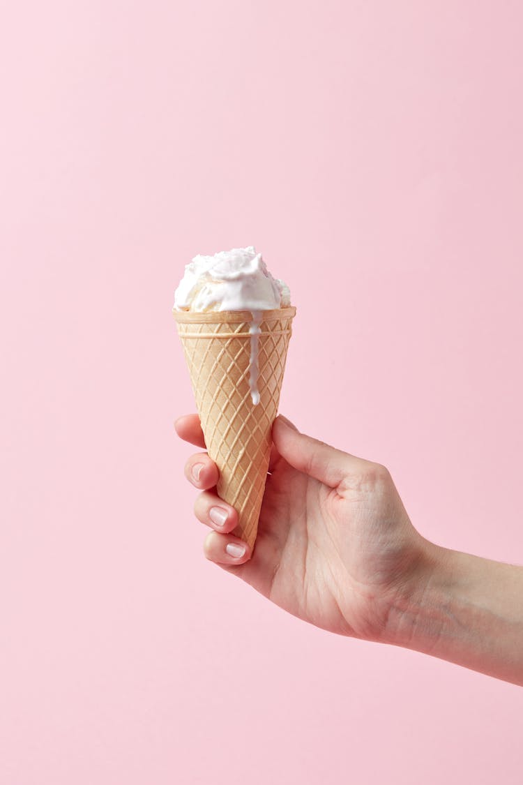 Person Holding Ice Cream Cone