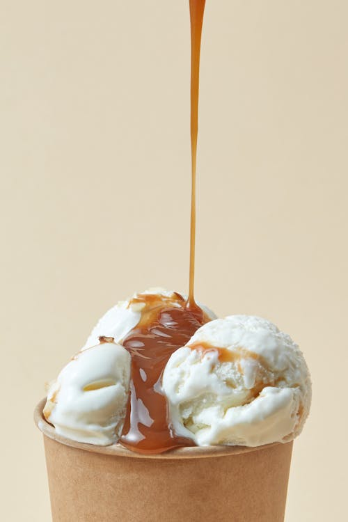 Studio Shot of Caramel Pouring on an Ice Cream