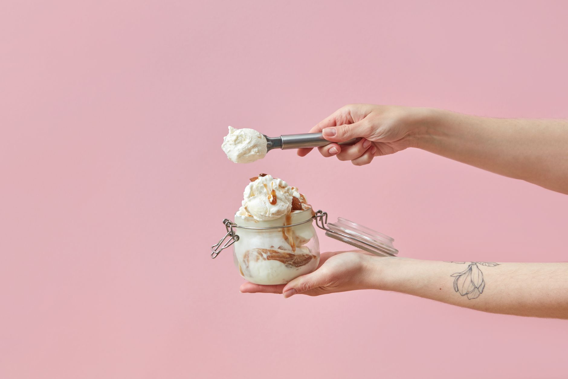 Salted caramel ice cream scoops with pecans and caramel drizzle