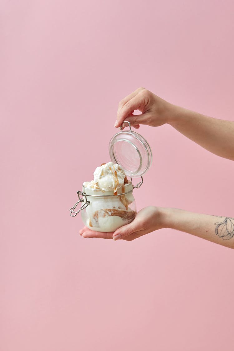 Woman Holding A Jar With Ice Cream 