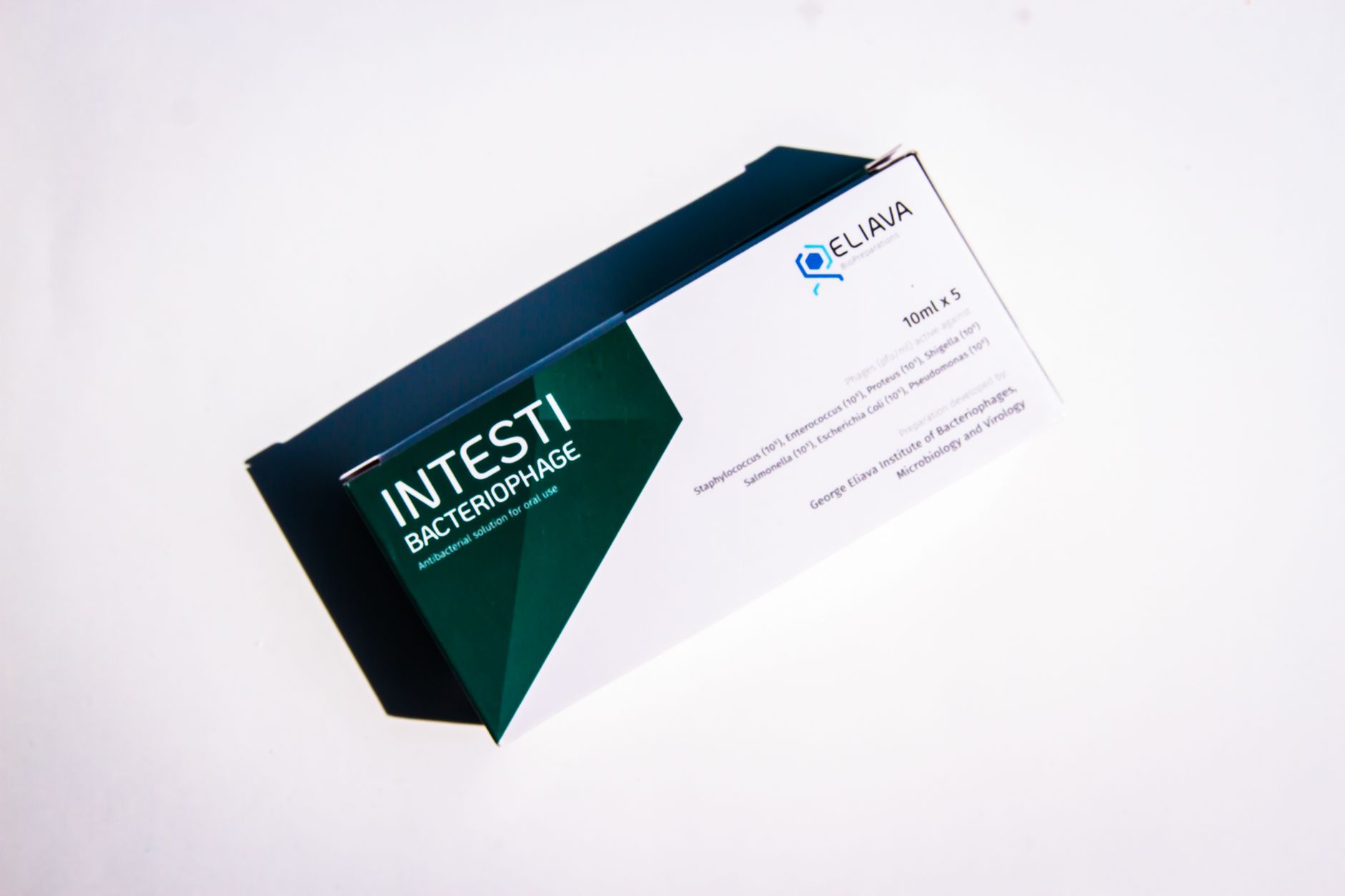 Close-up of Intesti Bacteriophage packaging box isolated on a white background, highlighting product design.