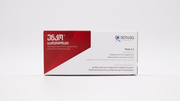 Box of medicine against bacteria with red and white packaging.
