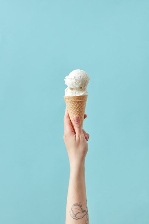Free Hand Holding Ice Cream Cone Stock Photo