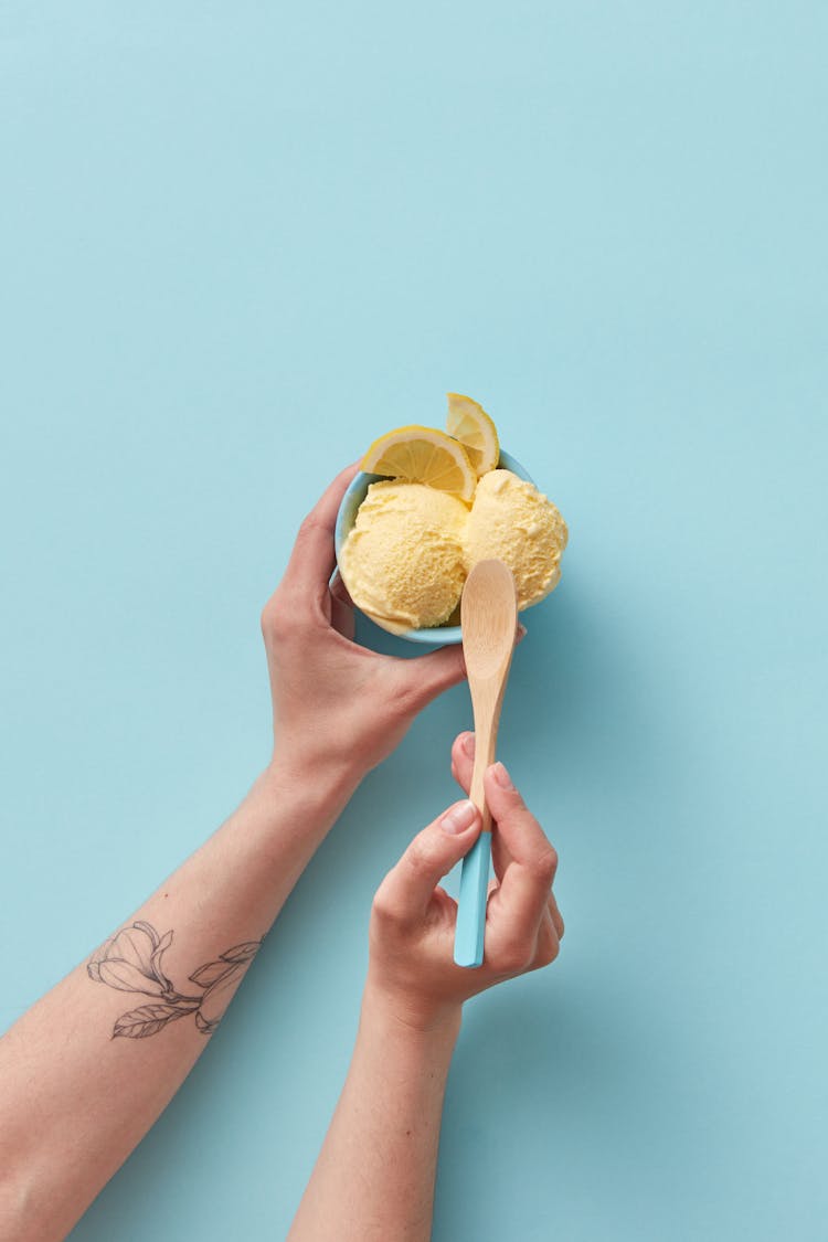 Woman Eating Ice Cream With Spoon