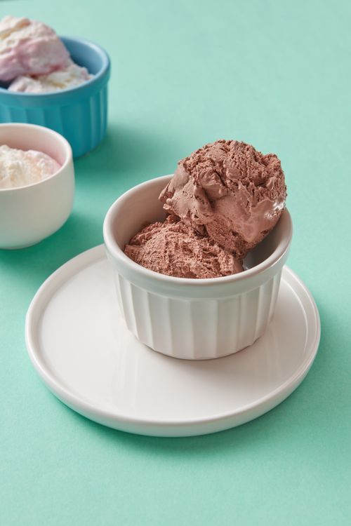 Free Delicious chocolate ice cream served in ramekins on a pastel backdrop. Stock Photo