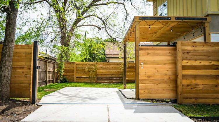 Photo Of Opened Brown Wooden Sliding House Gate