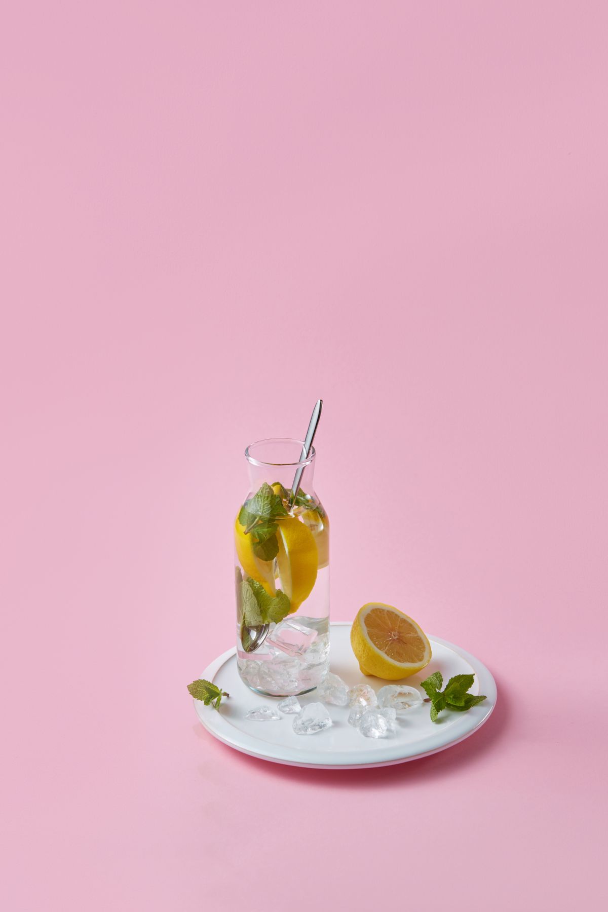 Colorful lemon and mint water creating an inviting daily hydration habit