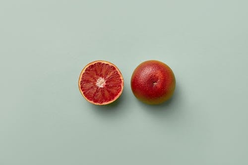 Free Overhead Shot of a Sliced Grapefruit Stock Photo