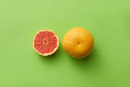 Grapefruits on Green Surface