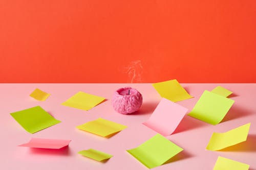 Brain Shaped Candle Surrounded by Sticky Notes 