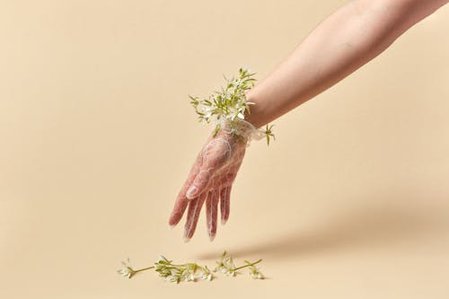 Hand in Lace Glove Decorated with Flowers