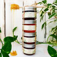 Jars of honey with a dipper — photo by negin marufi on Pexels