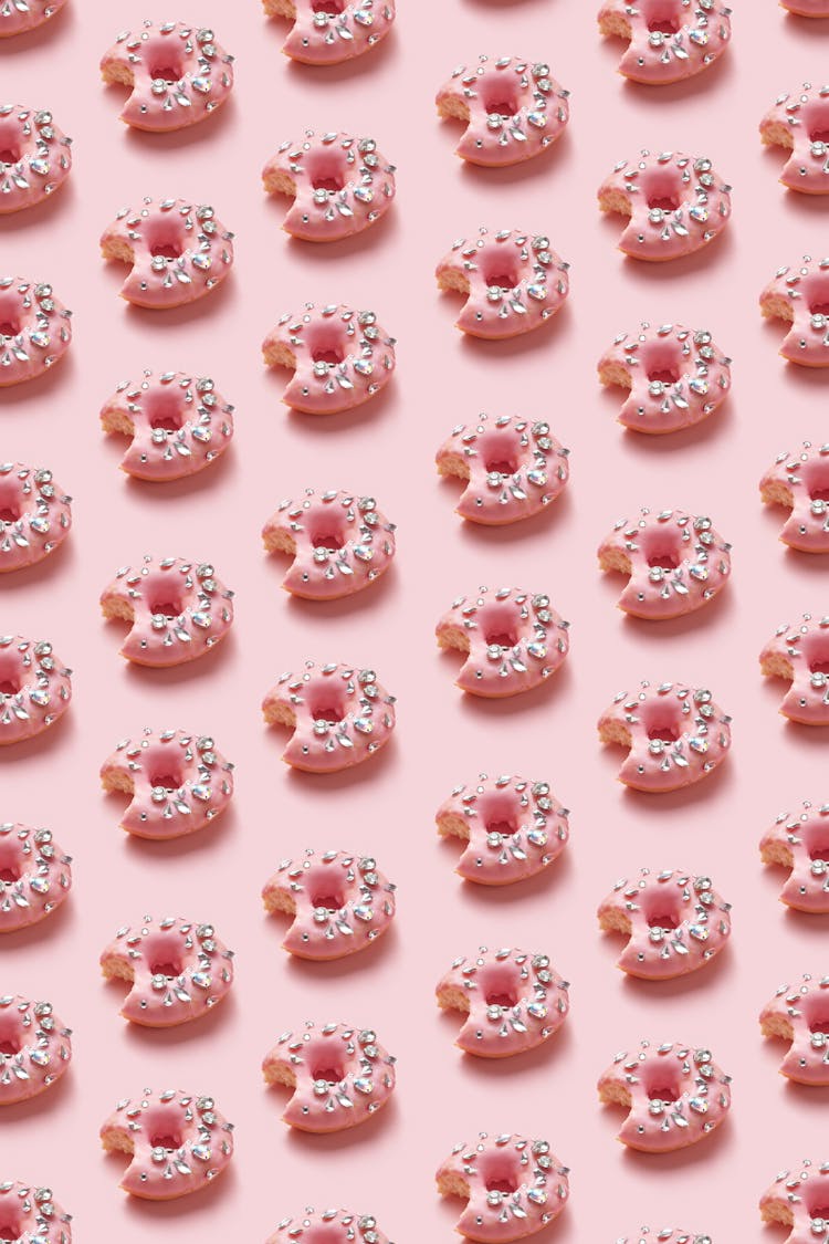 Doughnuts On A Pink Background