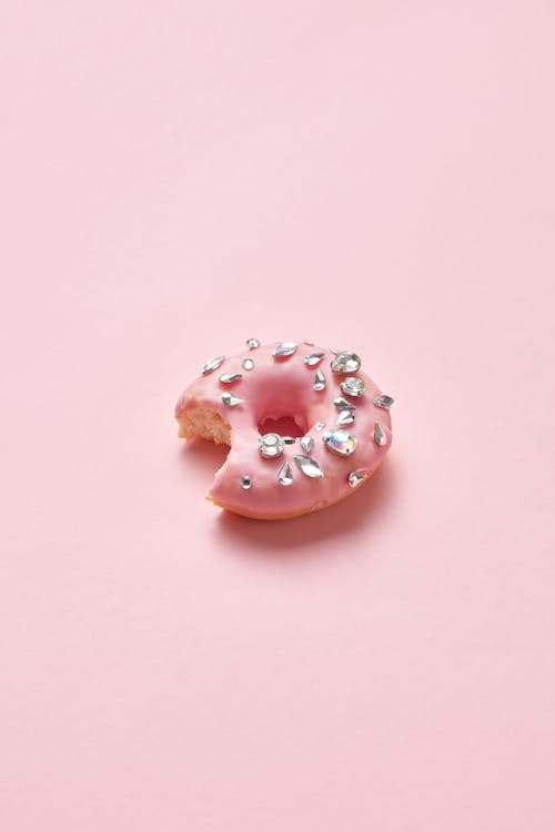 Photograph of a Bitten Donut with Diamonds