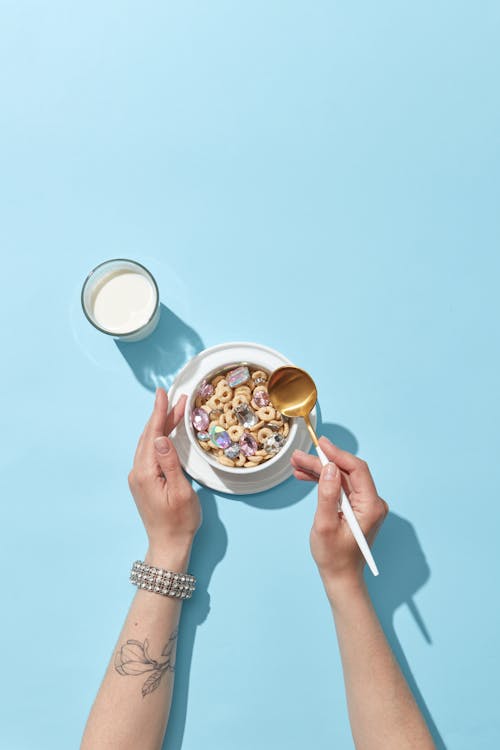 Hands of a Woman Eating Breakfast Cereal