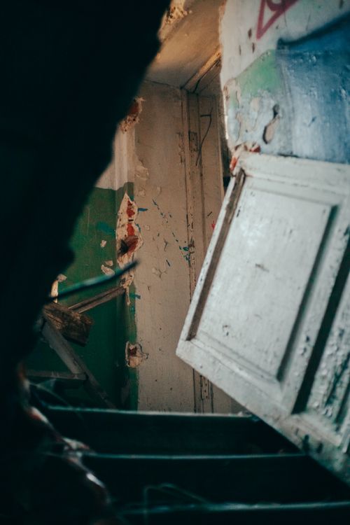 Free A haunting view of a crumbling staircase in an abandoned building in Saint Petersburg, Russia. Stock Photo